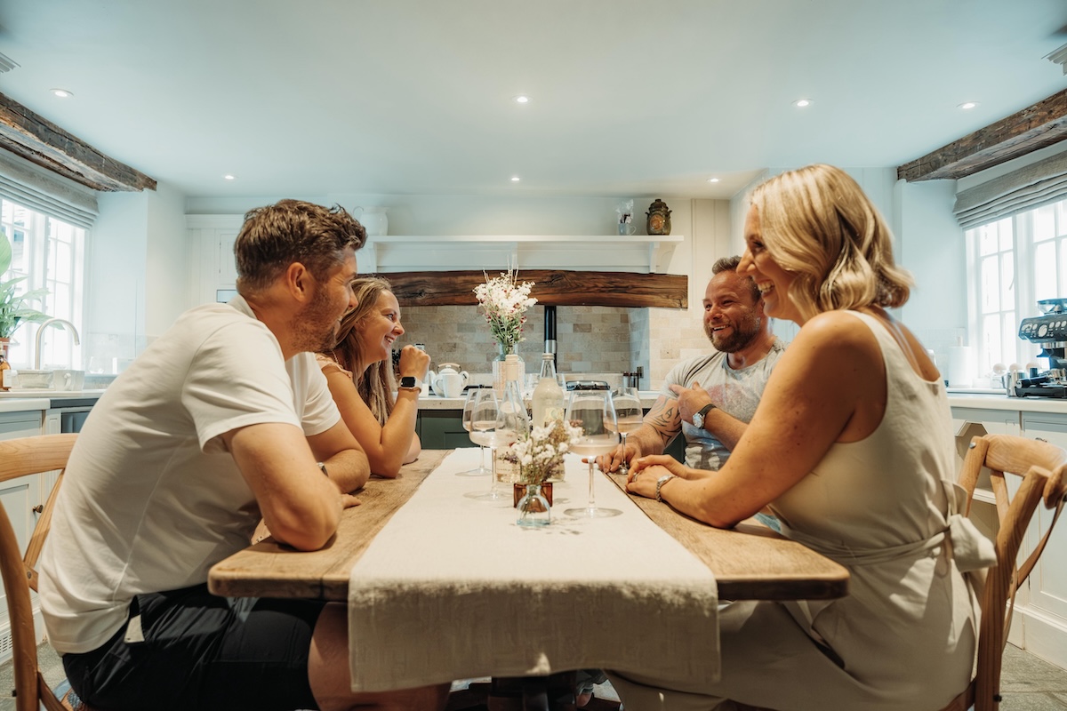 Guests enjoying a clean holiday let kitchen and dining space
